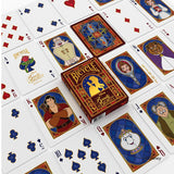 Playing cards with 'Beauty and the Beast' design on a white background
