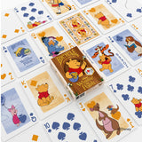 Winnie the Pooh-themed playing cards with a deck box in the center.