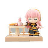 Figurine with pink hair and black outfit standing next to a small table with food on a white background