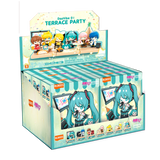 Box of character figurines with colorful packaging on a white background