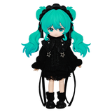 Toy figure with teal hair and black outfit on a white background