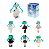 Set of Miku dolls with various outfits and a box on a white background