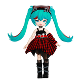 Toy figure with turquoise hair and a red and black outfit on a white background