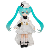 Toy figure with turquoise hair and a white outfit on a white background