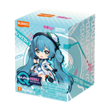 Box packaging of a character with blue hair and a white outfit, featuring branding and text.