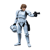 Action figure in a white suit holding a helmet and gun on a white background
