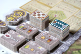Board game components including cards and pieces on a table