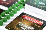 Card game with green markers and a 'Spoiler' card on a white surface