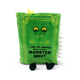 Green plush toy book with monster face and text on a white background