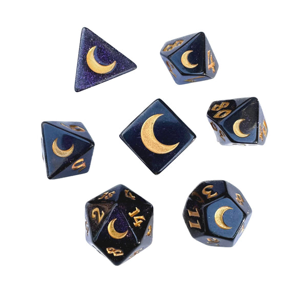 Set of polyhedral dice with moon symbols on a white background