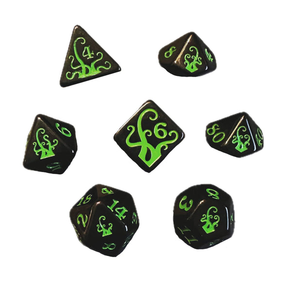 Set of black dice with green numbers and symbols on a white background
