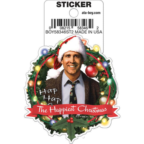Sticker of a person in a Christmas wreath with text 'Hap Hap The Happiest Christmas' on a white background.