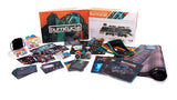 Burncycle board game components including cards, dice, and box on a white background