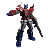 Optimus Prime action figure from Transformers, shown in a dynamic pose holding a rifle, isolated on a white background.