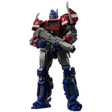 Transformers Optimus Prime action figure holding a large gun, shown against a plain white background.