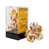 Chessex dice set with packaging on a green background