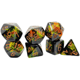 Set of polyhedral dice with a black and green pattern on a white background