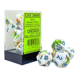 Polyhedral dice set with colorful numbers and lettering, displayed with Chessex packaging.