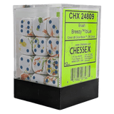Box of Chessex dice with a green label