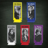 Five portrait stands with labeled characters on a dark background