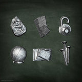 Collection of metallic objects including a sphere, lock, and others on a dark background