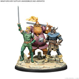 Three figurines in Viking-style clothing with weapons on a white background