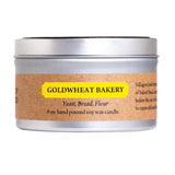 Candle tin with 'Goldwheat Bakery' label on a white background