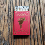 Red matches box with '22 Ways to Summon Fire Elementals' text on a wooden surface