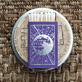 Matches in a purple box titled 'A History of Divination' on a textured woven surface