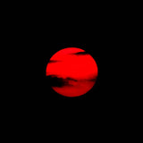 Red sun or planet against a black background