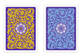 Two decorative card backs shown side by side on a white background. The left card has a purple field with ornate gold scrollwork and a white floral medallion.