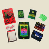 Collection of colorful cards and game components on a beige background