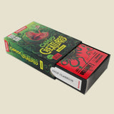 Box of 'Campy Creatures' trading cards with green and red design on a beige background
