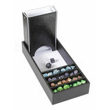 Collection of dice in a black dice tray with compartments on a white background