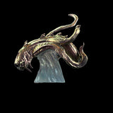 Bronze dragon head sculpture on a black background