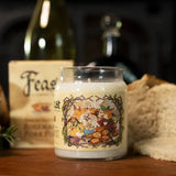 A glass jar candle with a cream-colored wax and a detailed autumn forest label featuring foxes, pumpkins, and leaves, styled on a wooden table with bread and wine bottles in the background.