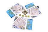 Collection of board game cards with various designs on a white background
