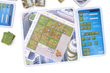 Board game components including cards and a scoring reference sheet on a white background