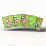 Set of board game tiles with green and brown designs on a white background