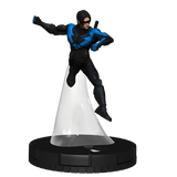 Superhero figurine in black and blue costume on a white pedestal with black base