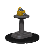 Toy-like object with a yellow box and metallic balls on a black stand against a white background