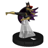 Batgirl figurine in black and gold costume on a white background