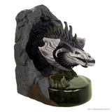 Dragon sculpture on a rocky base with a white background