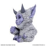 Fantasy creature figurine with purple accents on a white background