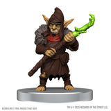 Fantasy figurine with green weapon on a white background