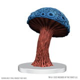 Blue and red fantasy mushroom figurine on a white base with 'Wizards of the Coast' branding.