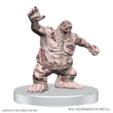 Zombie figurine on a white base with 'Wizards of the Coast' branding.