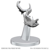 White dragon figurine on a stand with 'Wizards of the Coast' branding.