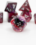 Set of polyhedral dice with red and black colors on a white background