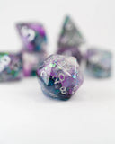 Set of polyhedral dice with purple and green gradient on a white background